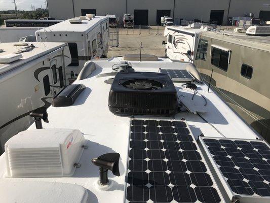 Roof finished view, showing solar panels, retractible HD Winegard Sat Dish, and vents and hatches.