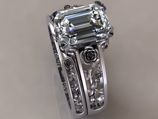 Custom designed "Rose" ring set with 2carat Emerald diamond.