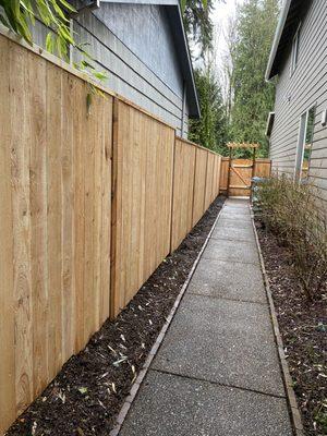 Solid privacy fence with gate & arbor