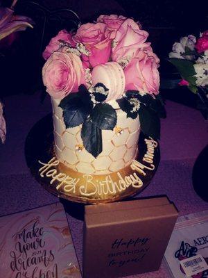 Cake with gold honeycomb design, cute bumblebees and pink roses on top!