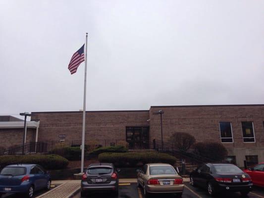 The American flag waving high above this library.