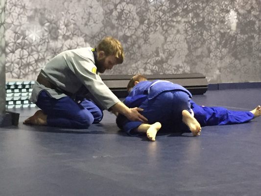 Coach Kurt erring on the ground and helping my son through some new moves.