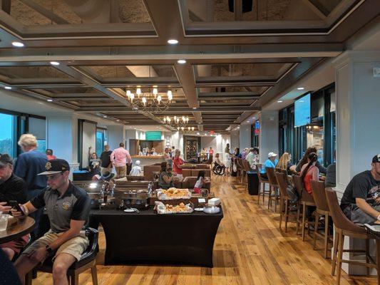 The air conditioned club. Windows and ball field to the right.