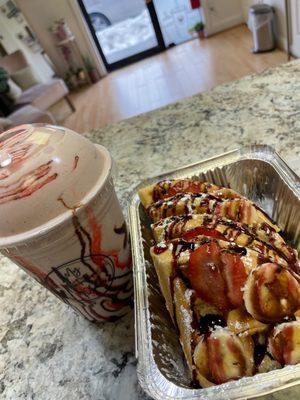 Strawberry covered chocolate shake and waffles ‍