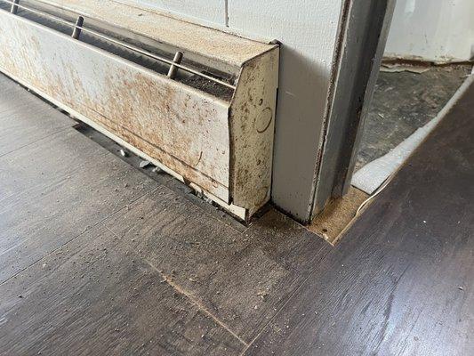 Another damaged cutting, instead of flash going under heater baseboard