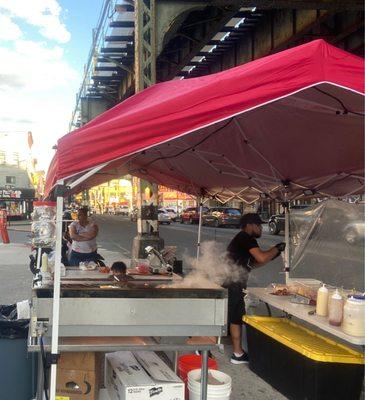 Tent setup on intersection of Broadway and Bartlett Street in Brooklyn, right outside the Food Bazaar parking lot.