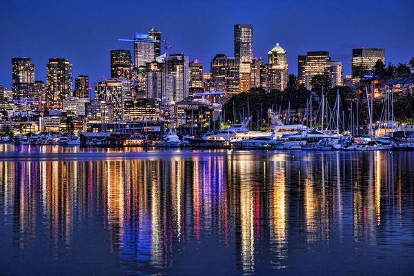 "The Everlasting Evolution of the Emerald City":  Illumination of the Seattle skyline reflected on Lake Union.