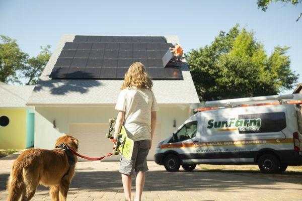 SunFarm Energy installers put the finishing touches on an array in Gulf Breeze.