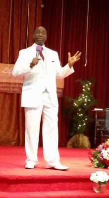 Pastor Adeniyi ministering at the St Paul Regional Church.