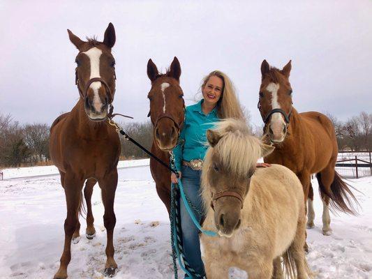 Shelby Williams, owner of Texas Equine Education & Horsemanship with a few of her equine friends playing in the snow.