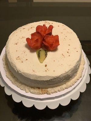 Tres leches white cake with whipped cream.