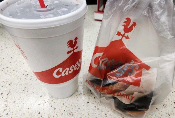 Diet coke and cake donuts with chocolate icing