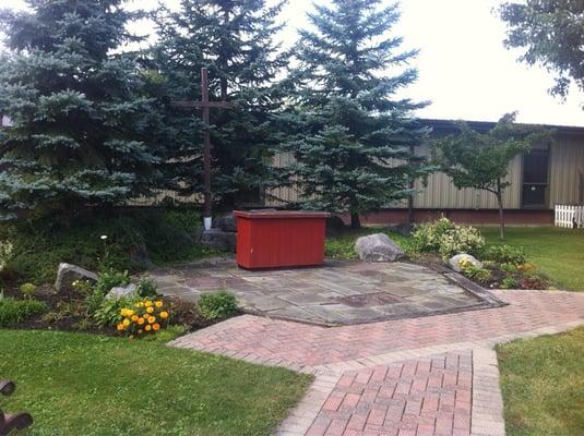 Outdoor altar at St. Matthews. Nice size lawn in front with room for a couple hundred people.