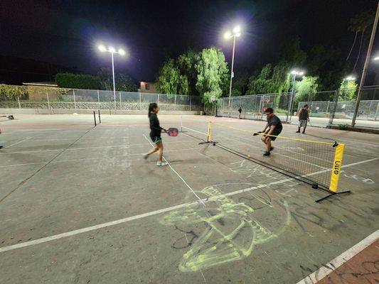 setting up our own pickleball court on the non-existent tennis courts!