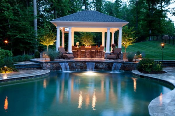 Residence overlooking the Occoquan Reservoir: freeform pool with waterfalls, kitchen pavilion, raised stone spa & firepit.