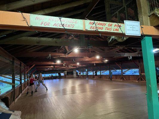 Open air skating rink with original wood floor.