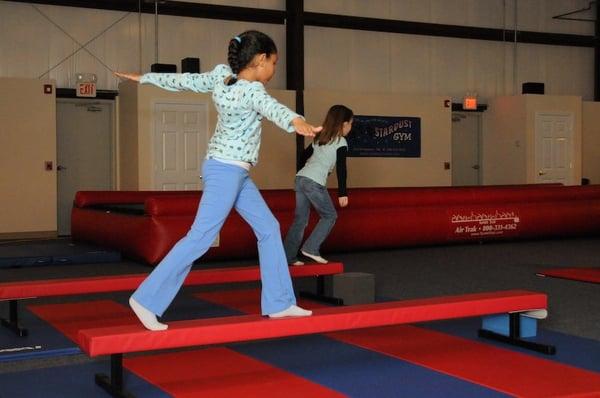 Gymnastics classes include balance beam, bars, vault and tumbling.