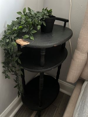 Flakeboard nightstand in master, chipped and a screw sticks out on top.