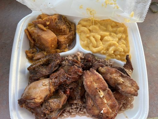 Brown stew chicken/jerk catfish combo: sides of mac & candied yams