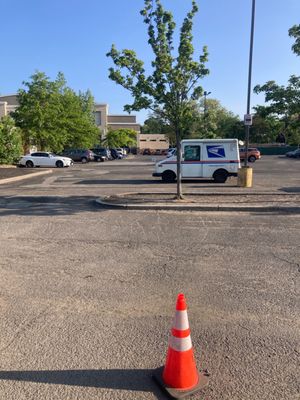 The parking lot in front of el bandido but the entrance is after the mobile gas station