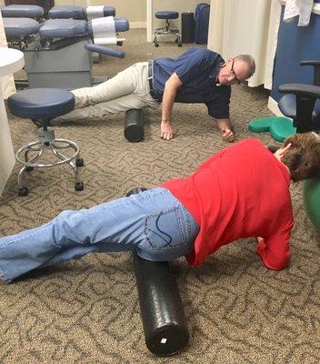 Dr. Haven Demonstrating use of the foam roller to patient.