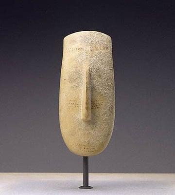 A marble head of the Cycladic, ca. 2600-2500 BC. Sold by the Merrin Gallery to the J. Paul Getty Museum, California.