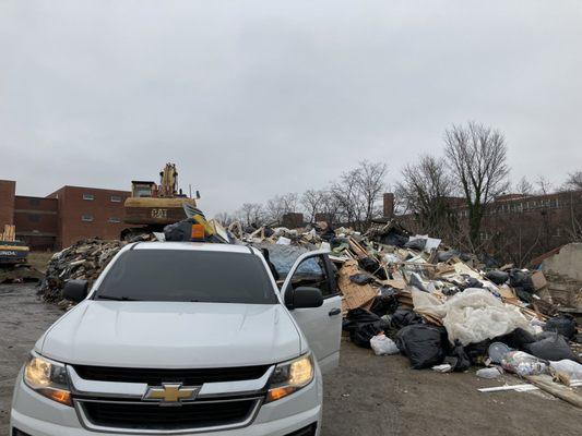 Roger brothers trash yard , we offload construction debris properly