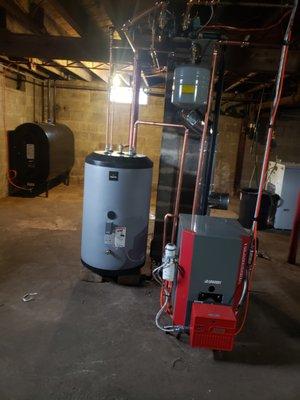 Brand new oil boiler, water tank and oil tank.