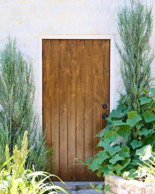 Knotty Alder garage entry door. Beautiful flush v-groove style.