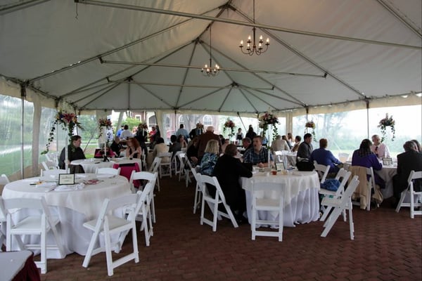 Tented patio during a reception.