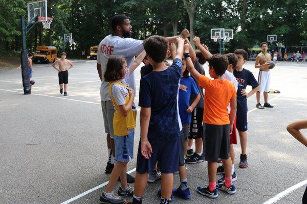 Coach Malachi motivates his team at LuHi Basketball Camp