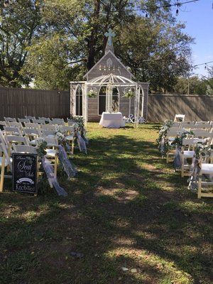 My ceremony set up in the back yard - the seating sign, chairs, table, and mr. & mrs. sign are all Tammy's.