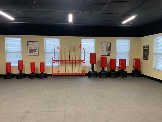 Weapons rack and punching bags.