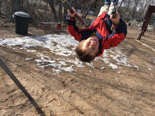 Child swinging on our playground.