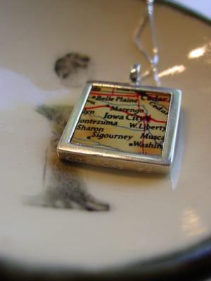 Iowa City pendant by Kathy Lowenstern on a saucer by Iowa artist, Amanda Barr