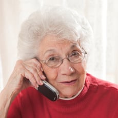 elderly lady calling for transportation