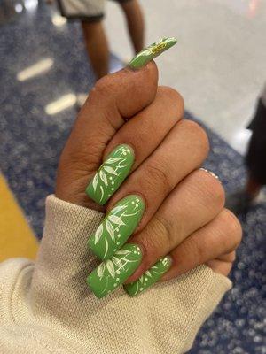 green nails with white flowers design