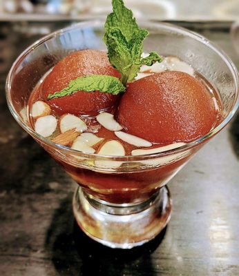 Gulab Jamun - Milk Dumplings in a warm sweet syrup. Almost like a syrup-soaked mini pancake!