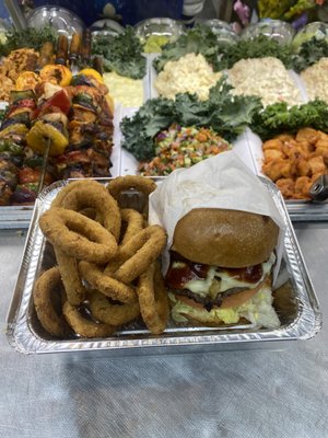 Double cheeseburger deluxe with onion ring's.