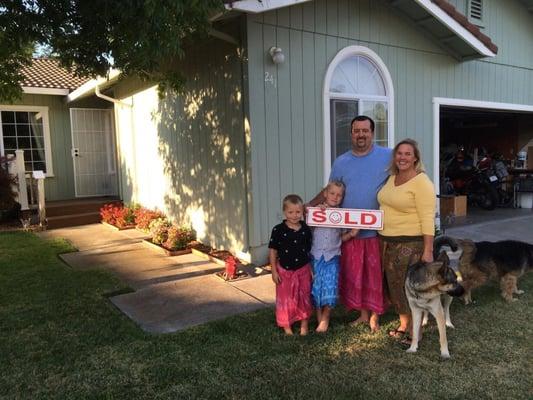 Greg & Carrie Weaver with their family in their new home