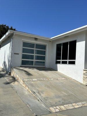 Newly installed rain gutters above driveway