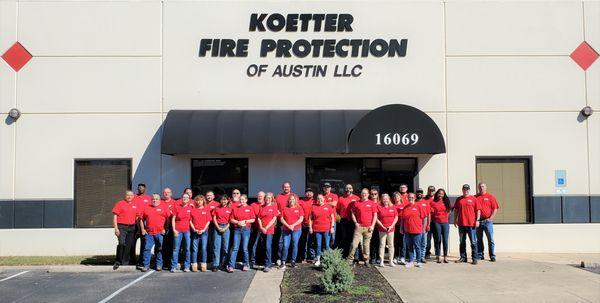 2021 Koetter office employees wearing RED to Remember Everyone Deployed on Veteran's Day