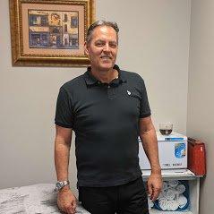 Greg Ramsey LMT with injury treatment and medical massage certification.