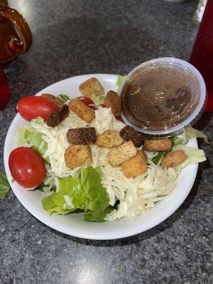 Side house salad that comes with entree. Actually, there weren't as many tomatoes, those were from my friend.