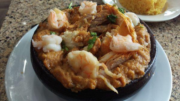 Cazuela de Pescado y Camarón: Fish & shrimp casserole with mashed green plantain & peanuts served in a hot clay pot