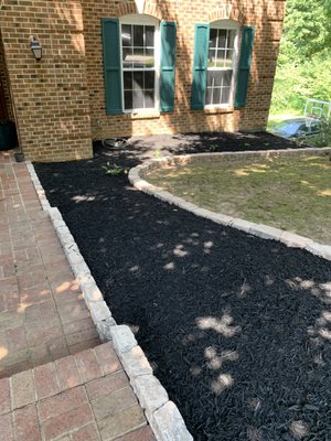 Added stone boarder and black dyed mulch!Stone