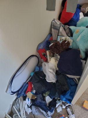 My son's items dumped in his bedroom closet as part of their 'full unpack'.