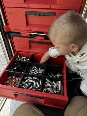 My little boy cohen helping me restock the work truck