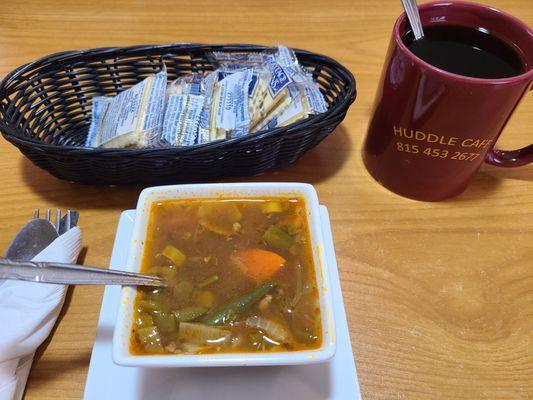 Vegetable beef soup, crackers and a cup of coffee