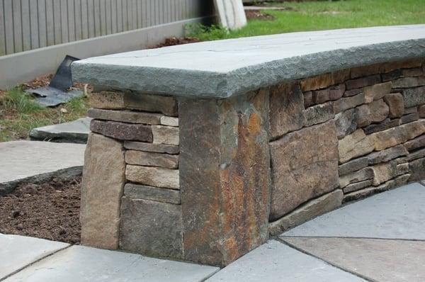 fieldstone wall with bluestone coping